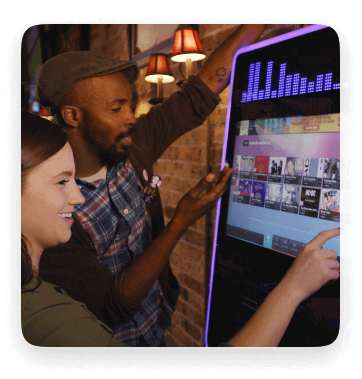 people playing music on the virtuo jukebox